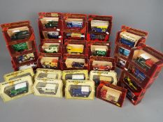 Matchbox - 31 boxed Matchbox Models of Yesteryear in a mix of Straw and Maroon boxes.