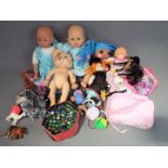 A good mixed collection containing a quantity of unboxed dolls, figures and dolls accessories.