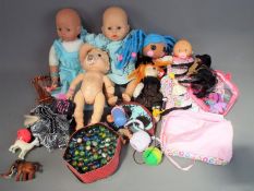 A good mixed collection containing a quantity of unboxed dolls, figures and dolls accessories.