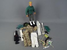 Hasbro - An unboxed 12 inch Hasbro GI Joe 'Duke' figure with stand plus accessories.