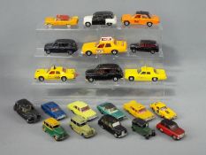 Corgi, Dinky Toys, Spot-On - A group of 20 unboxed diecast model vehicles many of which are taxis.