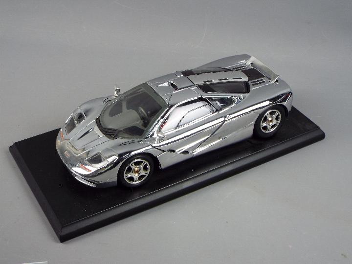 Maisto - A boxed Maisto Premier Edition 1:18 scale Chromium Polished McLaren F1. - Image 2 of 3