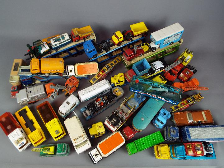 Corgi, Matchbox and others - In excess of 40 unboxed diecast model vehicles in various scales.