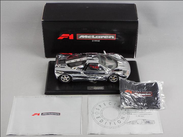 Maisto - A boxed Maisto Premier Edition 1:18 scale Chromium Polished McLaren F1.