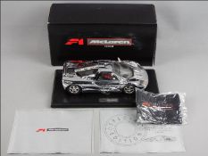 Maisto - A boxed Maisto Premier Edition 1:18 scale Chromium Polished McLaren F1.