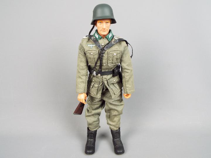 Dragon Models - An unboxed Dragon Models figure of a WW2 German soldier.