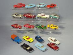 Corgi, Solido, Dinky Toys - A collection of 19 unboxed diecast model cars.