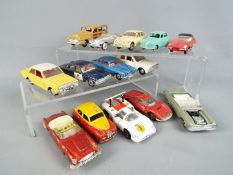 Dinky Toys - A collection of 14 unboxed diecast model cars by Dinky Toys.