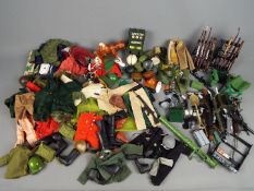 Palitoy - A very large unboxed collection of predominately vintage 'Action Man' uniforms,