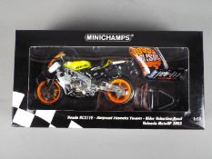 Minichamps - a 1:12 scale diecast model Honda RC211V, Repsol Honda Team,