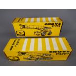 NZG - Two boxed diecast model cranes by NZG. Lot includes #149 Grove RT755; and #136 Grove TM800.