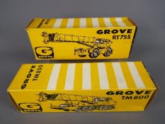 NZG - Two boxed diecast model cranes by NZG. Lot includes #149 Grove RT755; and #136 Grove TM800.