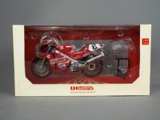 Universal Hobbies - a 1:12 scale diecast model Honda RC 30 as ridden by Carl Fogarty,