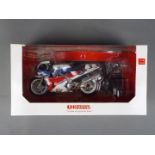 Universal Hobbies - a 1:12 scale diecast model Honda RC 30 as ridden by Joey Dunlop,