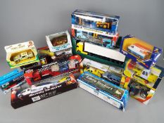 Corgi, Ertl, Teamsterz and others - 15 boxed diecast and plastic vehicles.