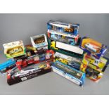 Corgi, Ertl, Teamsterz and others - 15 boxed diecast and plastic vehicles.