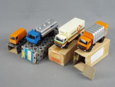 Conrad - Four boxed diecast vehicles.
