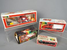 Yonezawa Diapet - Four boxed Japanese diecast vehicles by Yonezawa Diapet in various scales.