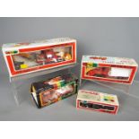 Yonezawa Diapet - Four boxed Japanese diecast vehicles by Yonezawa Diapet in various scales.