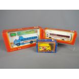 Tomica Dandy - A group of three boxed diecast vehicles in different scales by Tomica Dandy.