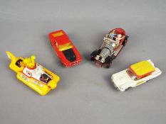 Corgi Toys - An unboxed group of four Corgi Toys diecast vehicles.