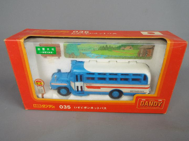 Tomica Dandy - A group of three boxed diecast vehicles in different scales by Tomica Dandy. - Image 2 of 4