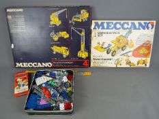 Meccano - Two boxed sets plus a tin containing a quantity of loose Meccano parts and ephemera.