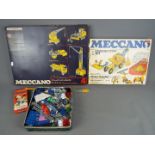 Meccano - Two boxed sets plus a tin containing a quantity of loose Meccano parts and ephemera.