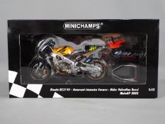 Minichamps - a 1:12 scale diecast model Honda RC211V, Repsol Honda Team,