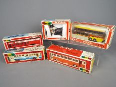 Yonezawa Diapet - Five boxed Japanese diecast vehicles by Yonezawa Diapet in various scales.