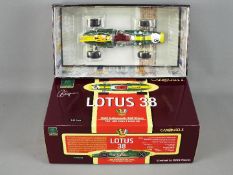 A Carousel 1 1:18 scale diecast model of a Lotus 38 1965 Indianapolis 500 racing car,