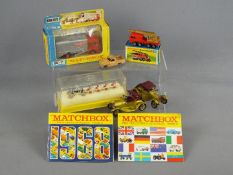 Matchbox - A small group of boxed and unboxed Matchbox vehicles in various scales,