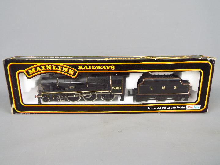 Mainline - an OO gauge locomotive and tender BR, Jubilee class, black livery,