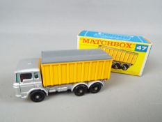 Matchbox by Lesney - Daf Tipper Container Truck, silver coloured cab and chassis, yellow container,