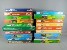 Nineteen jigsaw puzzles in original boxes, unchecked for completeness.
