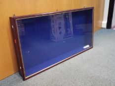 A wooden wall mounted display cabinet with glass opening door and four glass shelves,