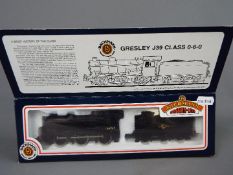 Bachmann - an OO gauge locomotive and tender BR black livery op no 64967, late crest # 31-852,