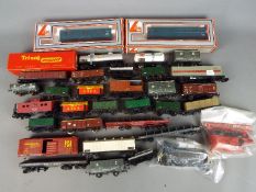 Model Railways - approximately 34 items of OO gauge goods rolling stock, predominantly unboxed,