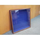 A wooden wall mounted display cabinet with glass opening door and three glass shelves,