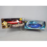 Ertl, Solido - Two boxed 1:18 scale diecast model cars.