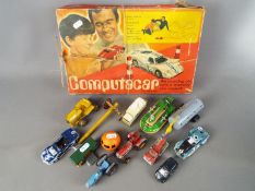 A boxed ‘Computacar’ battery powered programmable vehicle together with a collection of playworn