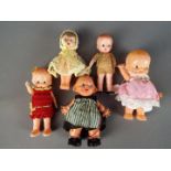 Celluloid Dolls - A collection of five celluloid dolls with Kewpie eyes ranging in size from 16 cm