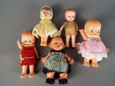 Celluloid Dolls - A collection of five celluloid dolls with Kewpie eyes ranging in size from 16 cm
