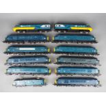 Bachmann, Hornby, Mainline - An unboxed assortment of 12 OO gauge diesel and electric locomotives.