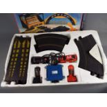 Scalextric - A boxed Scalextric Ford RS Cosworth Set, with a boxed Scalextric Accessory Set.