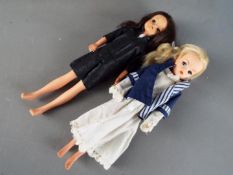 Pedigree Sindy - A pair of Pedigree Sindy dolls, a long blonde haired doll with painted eyebrows,