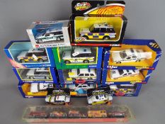 Matchbox, Corgi and others - A collection of 14 boxed mainly Police diecast model vehicles.