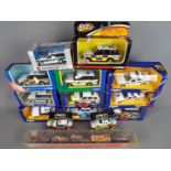 Matchbox, Corgi and others - A collection of 14 boxed mainly Police diecast model vehicles.