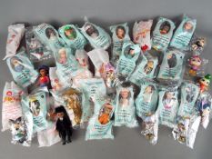 McDonalds Collectables - A collection in excess of 25 'Madame Alexander' dolls,