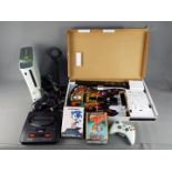 Xbox 360, Sega, Playstation - A mixed group of gaming equipment.